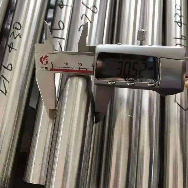 CuNi 90/10 seamless pipe dimensional inspection showing outside diameter measurement, wall thickness verification and quality control testing